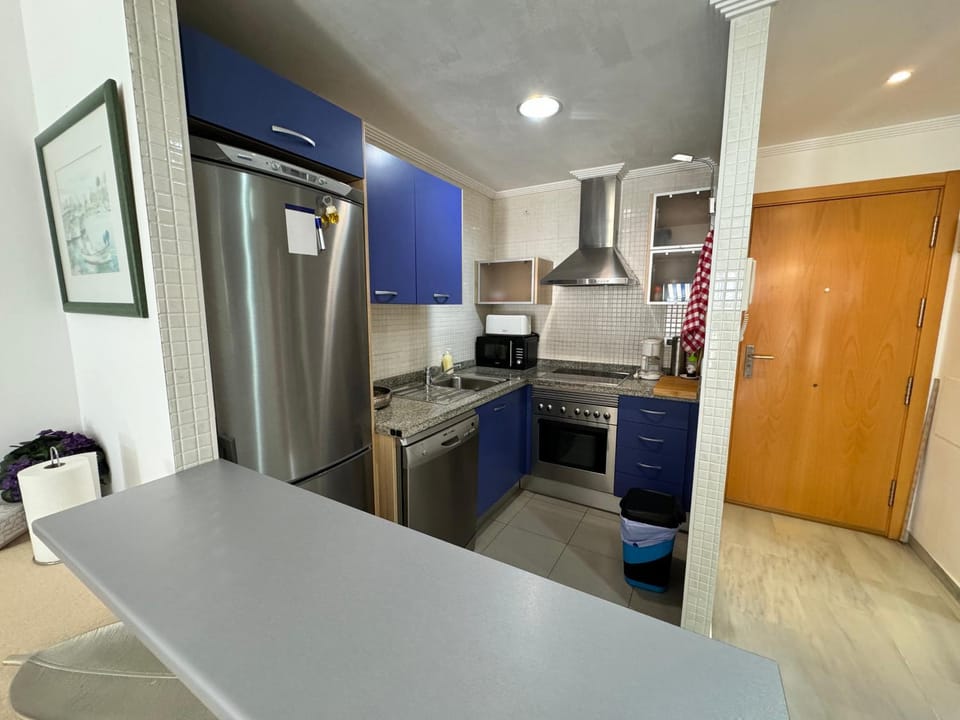 Kitchen or kitchenette, dishwasher, oven, stove