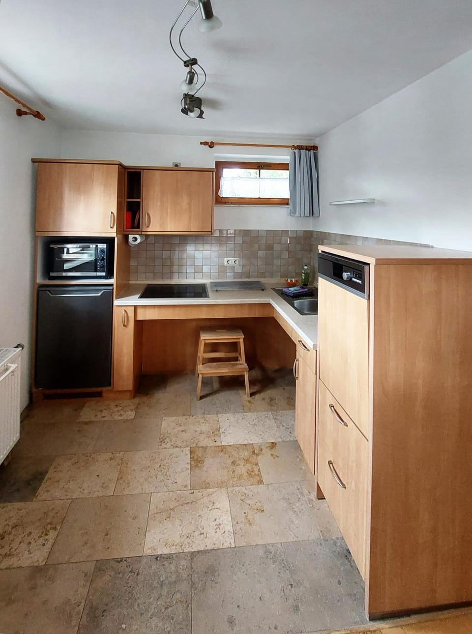 Kitchen or kitchenette, dishwasher, oven, stove