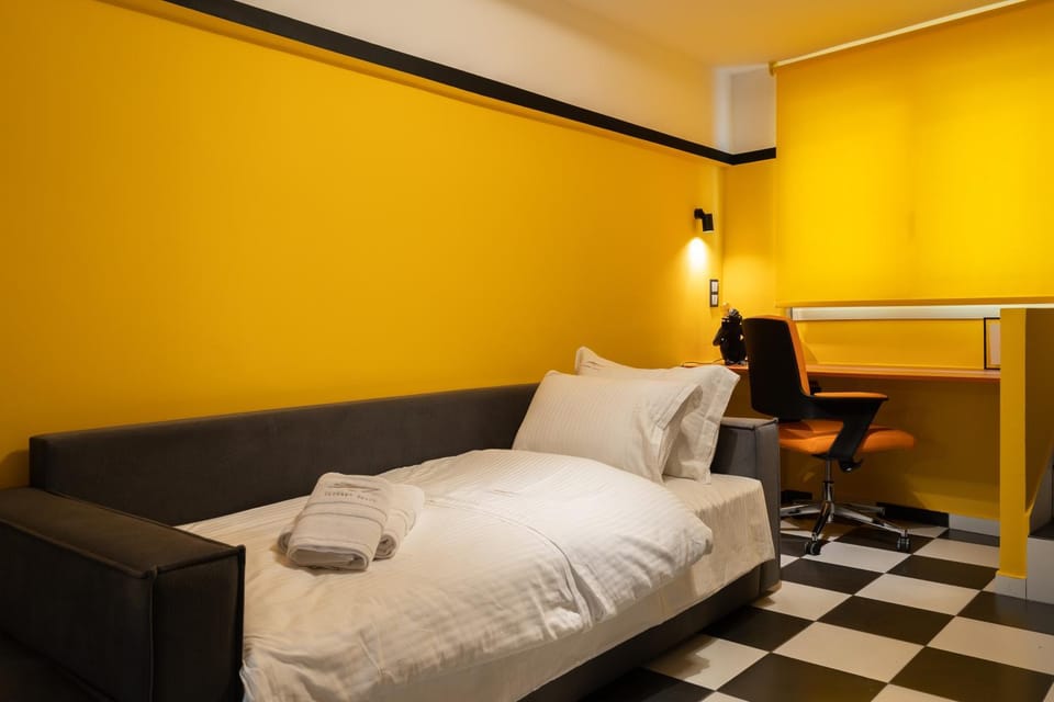 Bed, Living room, Seating area, Bedroom
