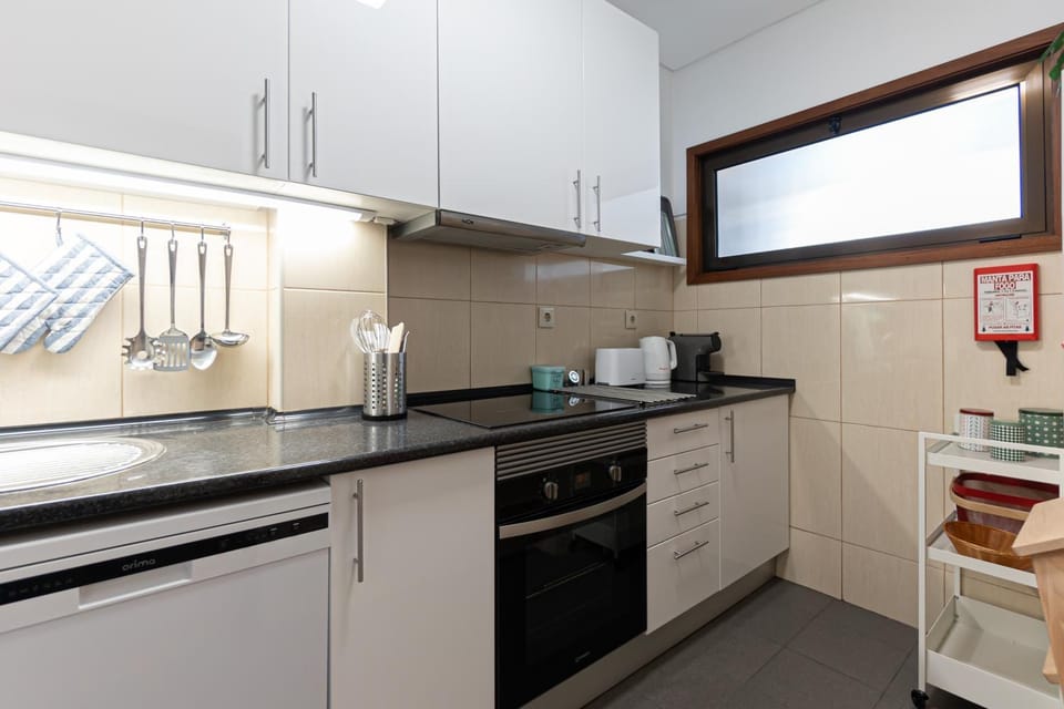 Kitchen or kitchenette, dishwasher, oven, stove, toaster