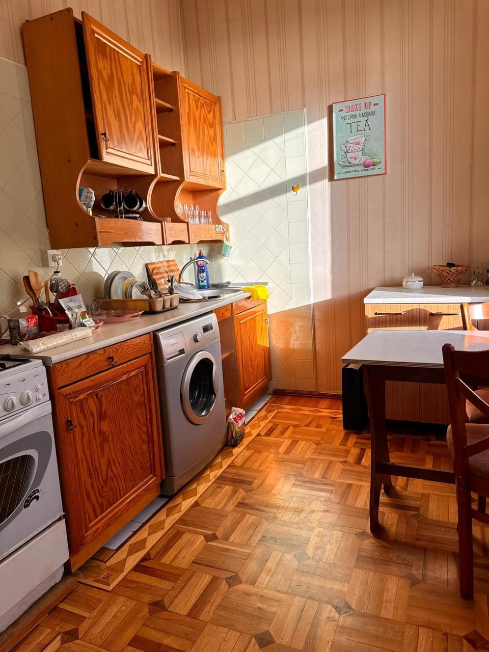Kitchen or kitchenette, stove, washing machine