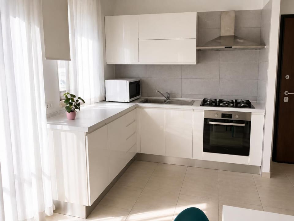 Kitchen or kitchenette, microwave, oven, stove