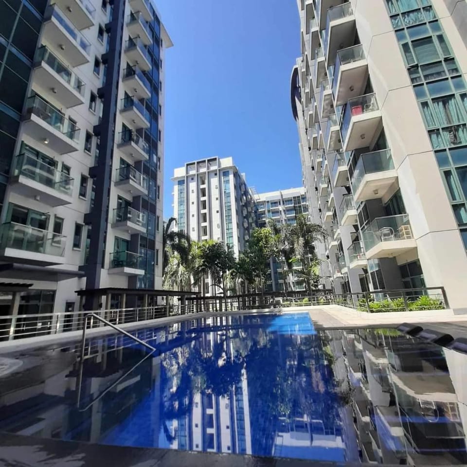 Property building, Day, Pool view, Swimming pool, sunbed