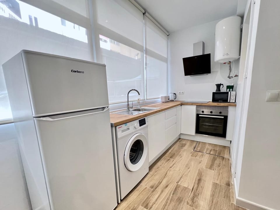 Kitchen or kitchenette, microwave, oven, washing machine