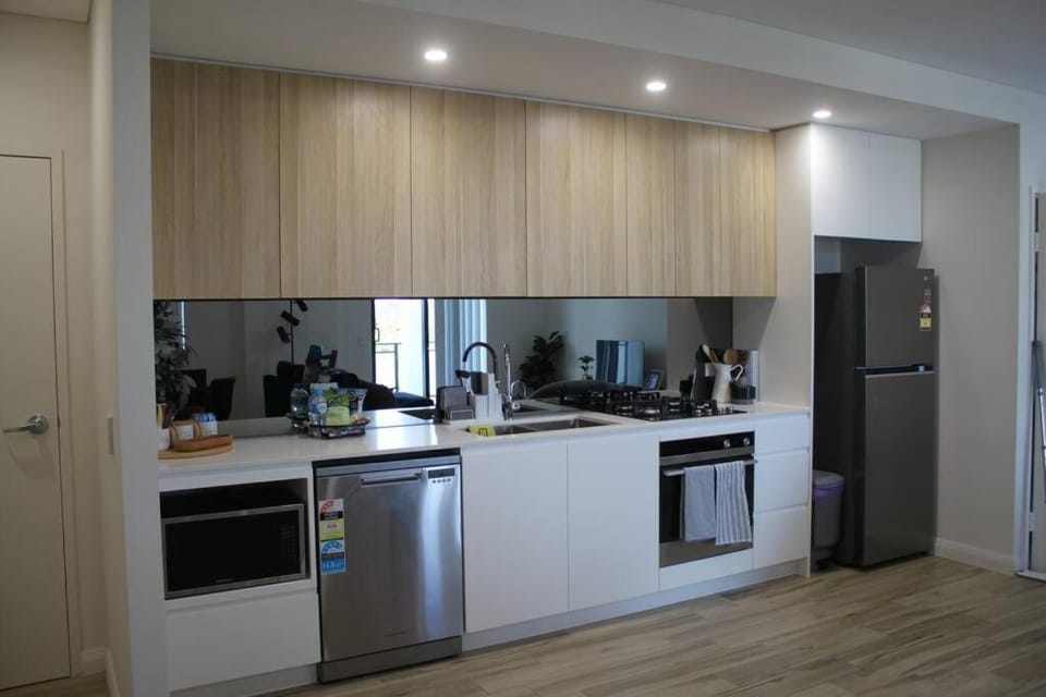 Kitchen or kitchenette, dishwasher, oven, stove