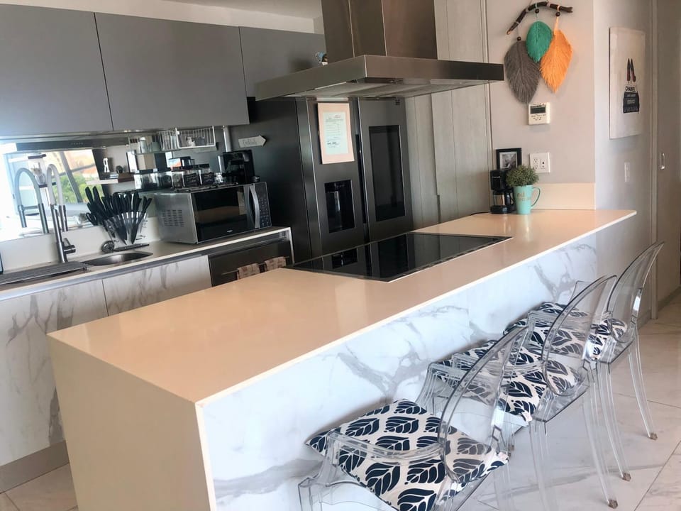 Kitchen or kitchenette, dishwasher, oven, stove