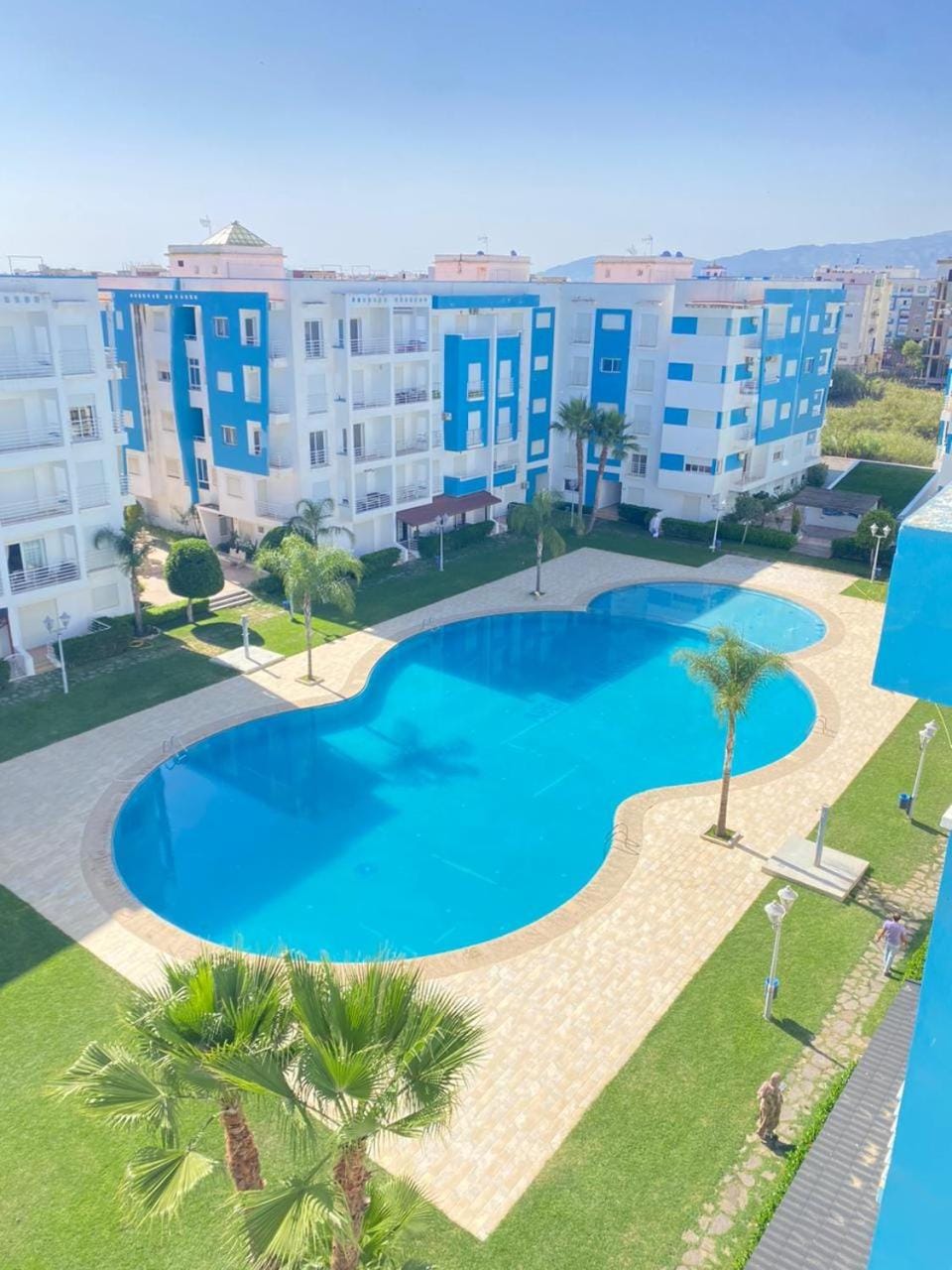 Property building, Spring, Day, Natural landscape, City view, Pool view, Swimming pool