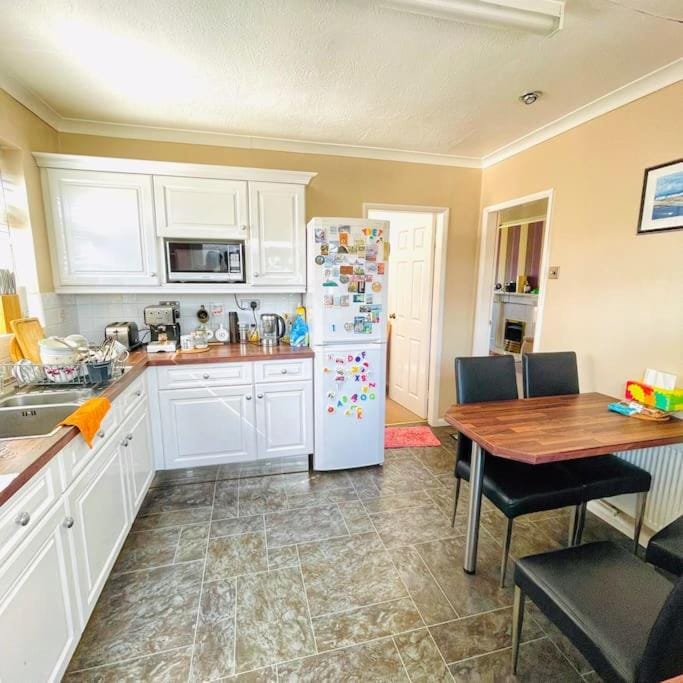 Kitchen or kitchenette, Dining area, dishwasher, oven, stove, toaster