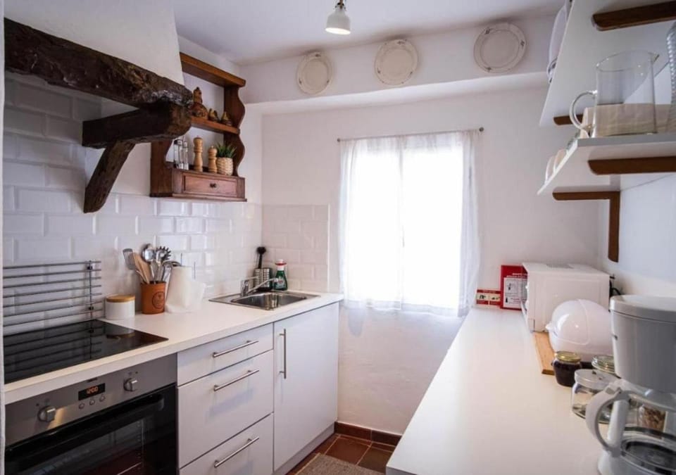 Kitchen or kitchenette, stove, toaster