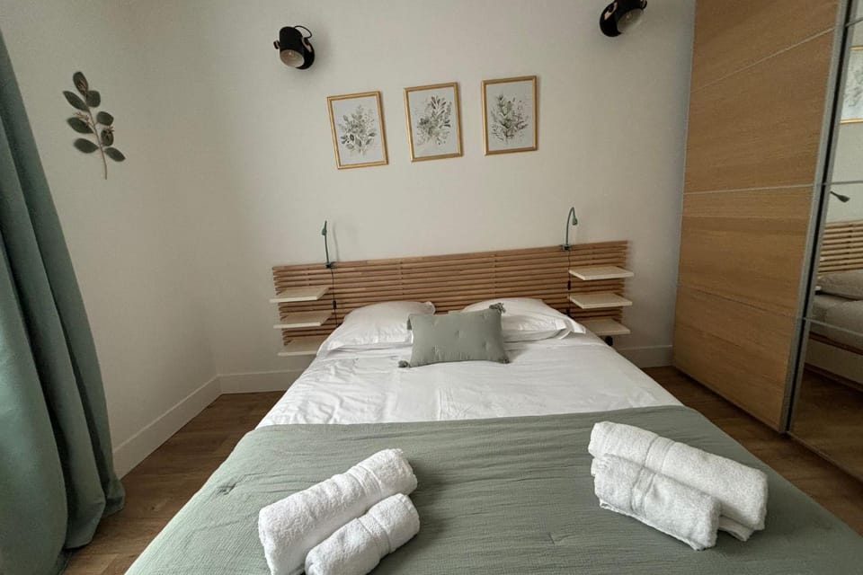 Bed, towels, wardrobe