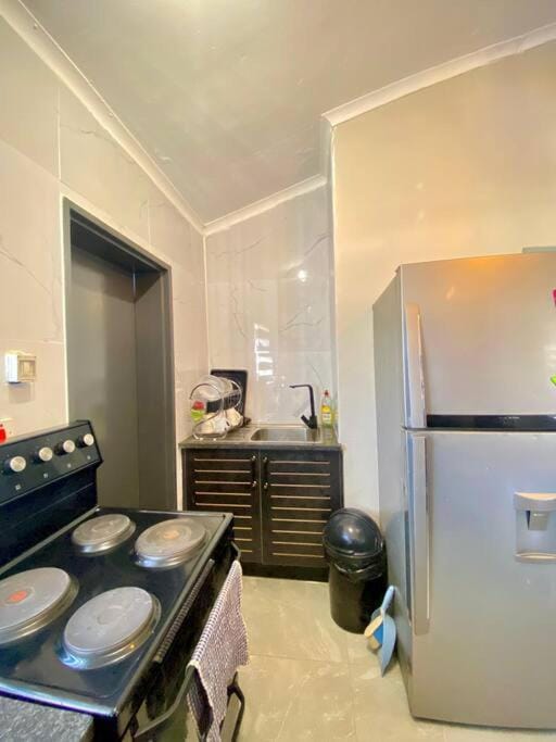 Down Town Delight - 2BR Budget Retreat House in Africa