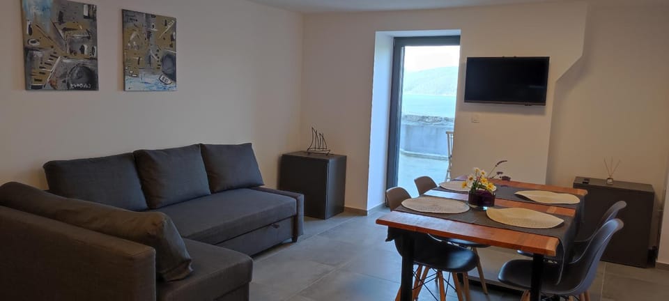 TV and multimedia, View (from property/room), Living room, Seating area, Dining area, Garden view, Sea view