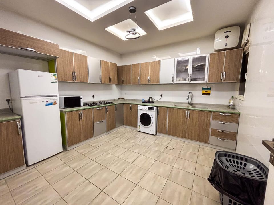 Kitchen or kitchenette, oven, stove, washing machine, dryer