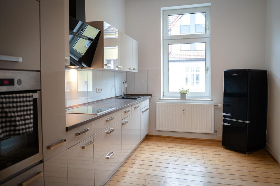 Kitchen or kitchenette, dishwasher, oven, stove