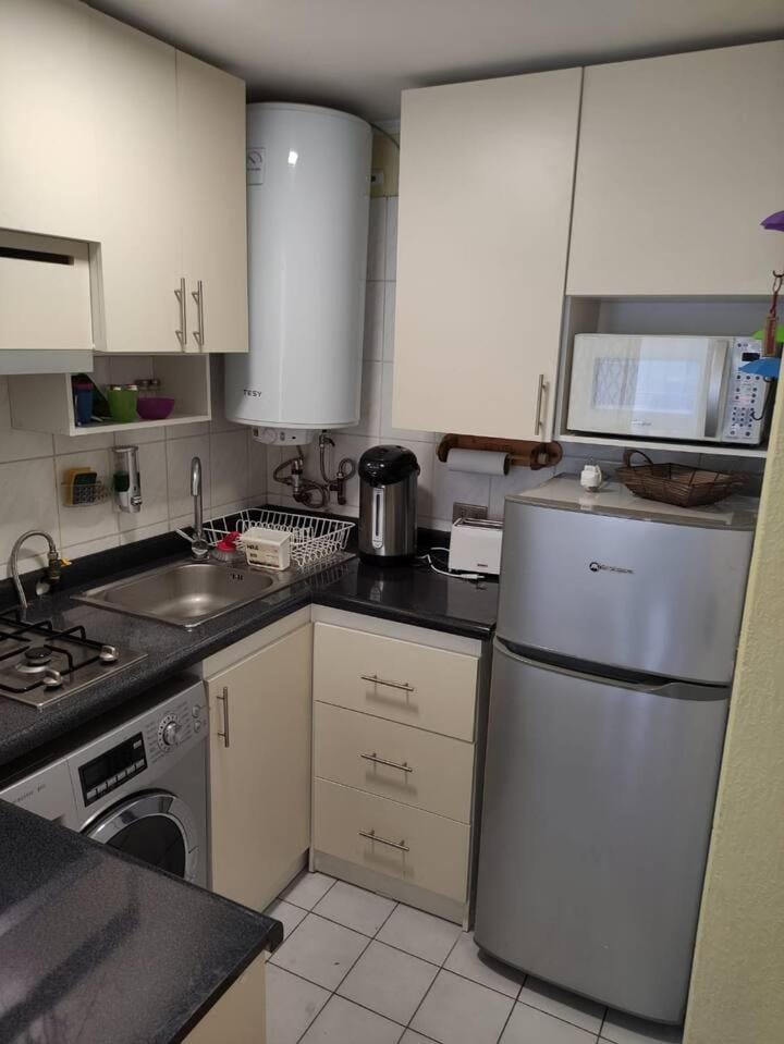 Kitchen or kitchenette, stove, toaster