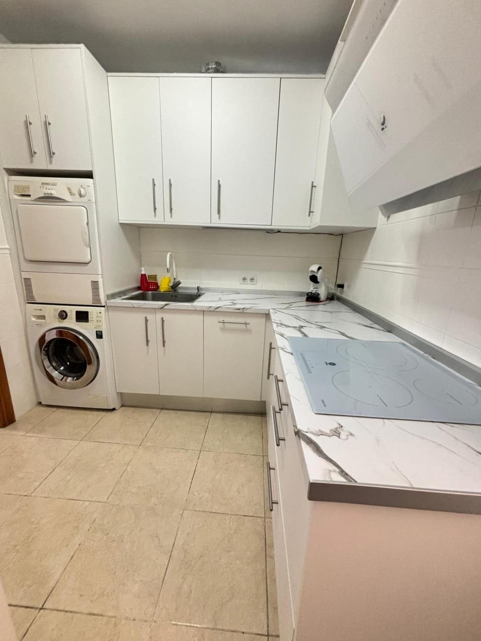 Kitchen or kitchenette, dishwasher, stove, washing machine, dryer