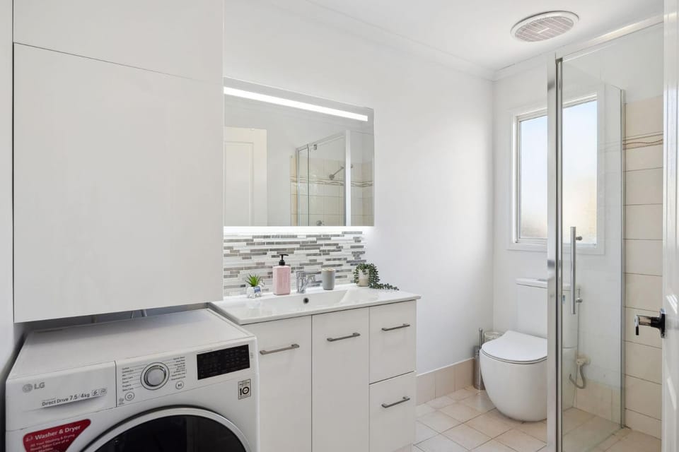 Shower, Toilet, Bathroom, towels, washing machine, dryer