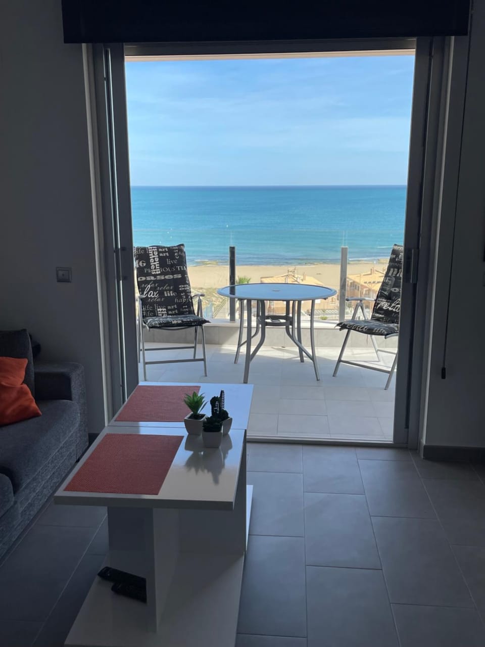 View (from property/room), Living room, Seating area, Beach, Sea view