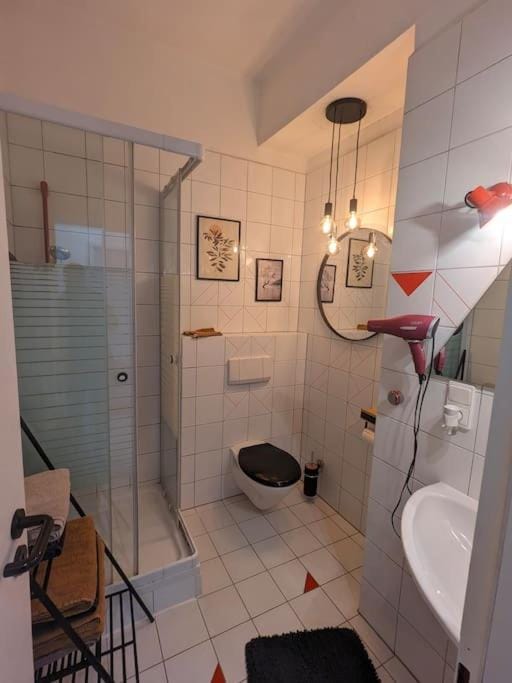 Shower, Toilet, Bathroom, hair dryier, towels