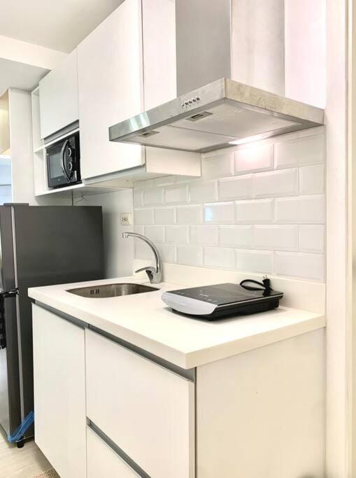 Blissful Bali Studio Azure North by THE BALI CORNER AT AZURE NORTH, High Floor, Beautiful View of Resort Amenities and Mt Arayat Apartment in Calabarzon
