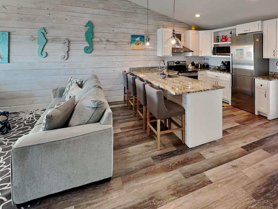 Kitchen or kitchenette, Living room, Seating area, furniture, microwave, oven