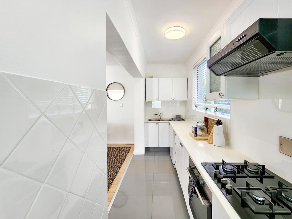 Kitchen or kitchenette, dishwasher, oven, stove, toaster