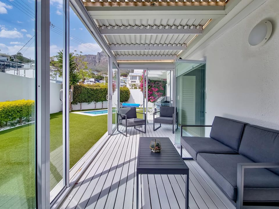Property building, Patio, Day, Garden, View (from property/room), Balcony/Terrace, Seating area, Garden view, Pool view, Swimming pool, sunbed