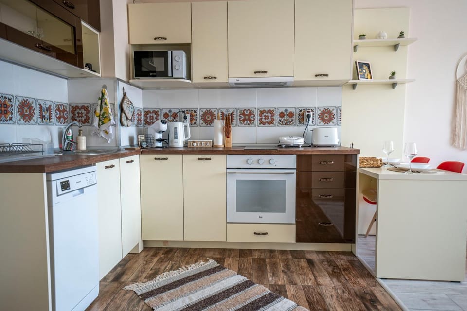 Kitchen or kitchenette, dishwasher, oven, stove, toaster