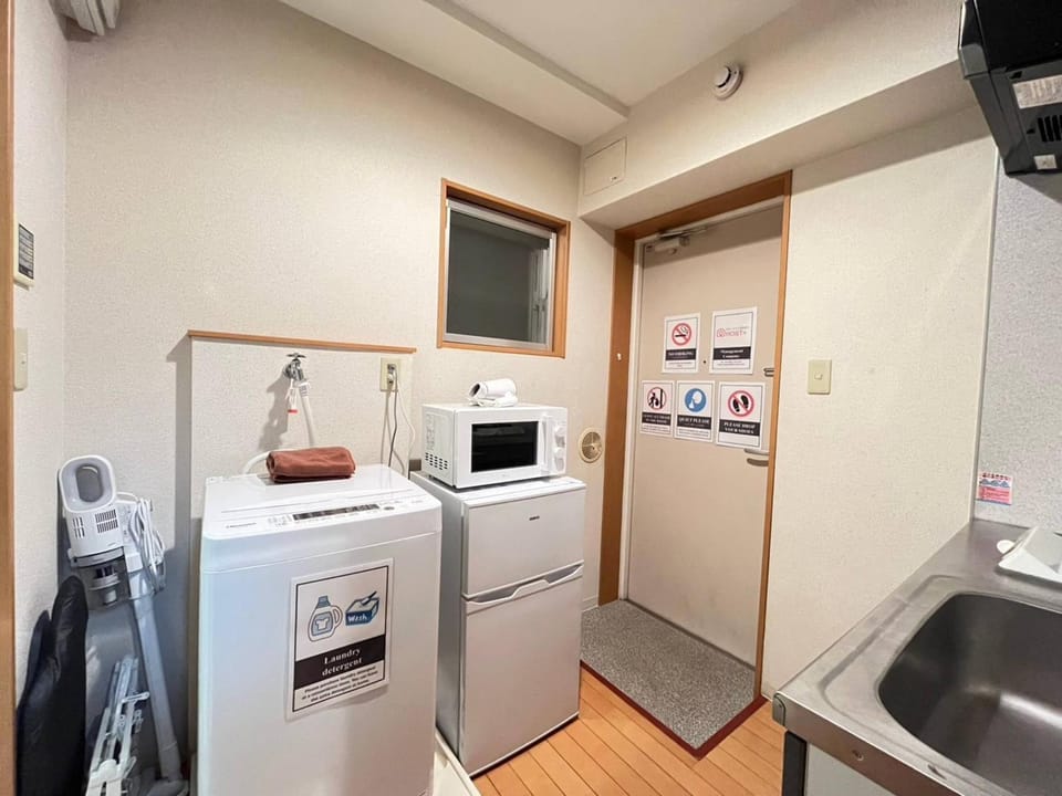 Kitchen or kitchenette, washing machine