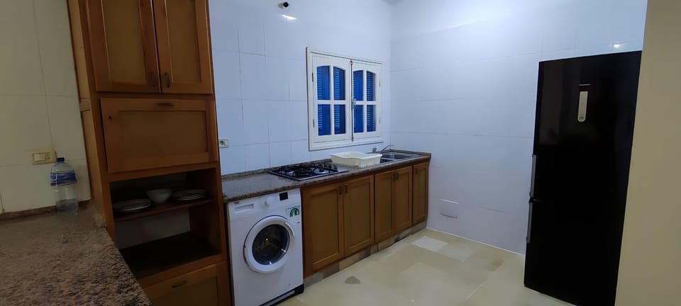 Kitchen or kitchenette, stove, washing machine