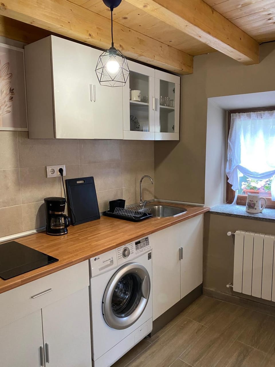 Kitchen or kitchenette, washing machine