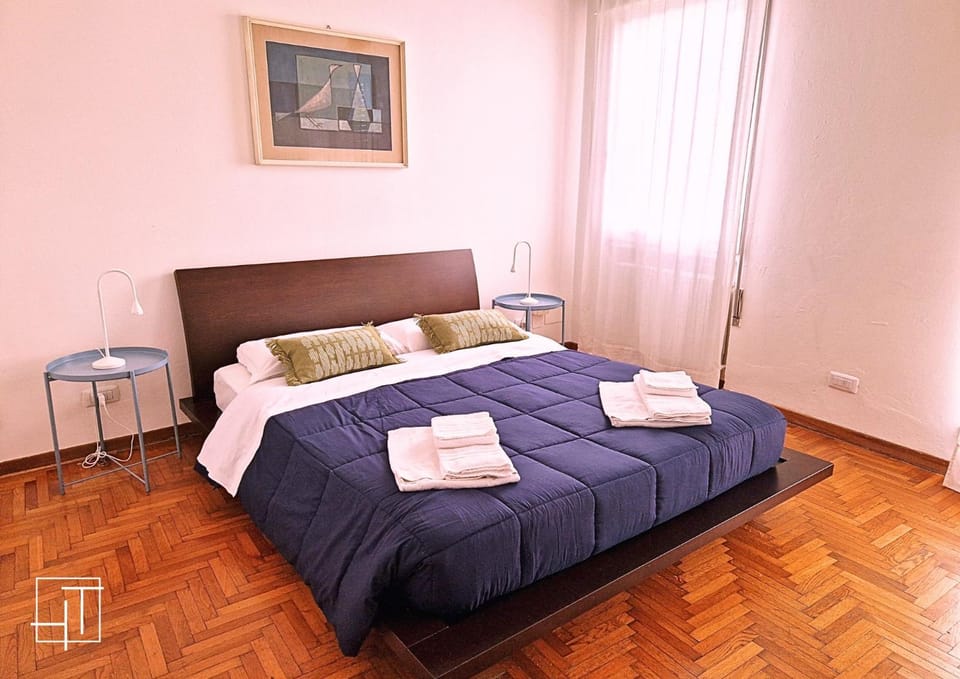 Bed, towels, wardrobe