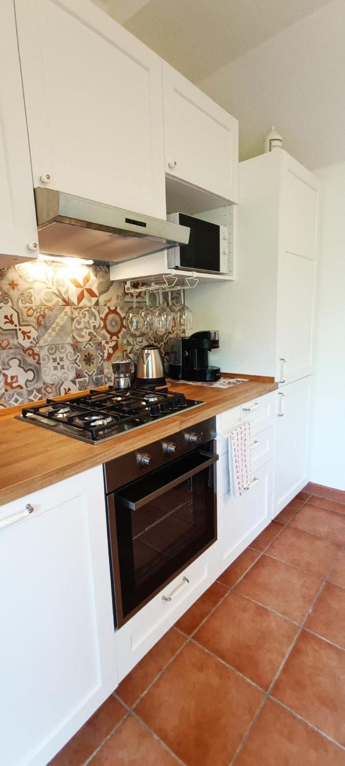 Kitchen or kitchenette, microwave, oven, stove