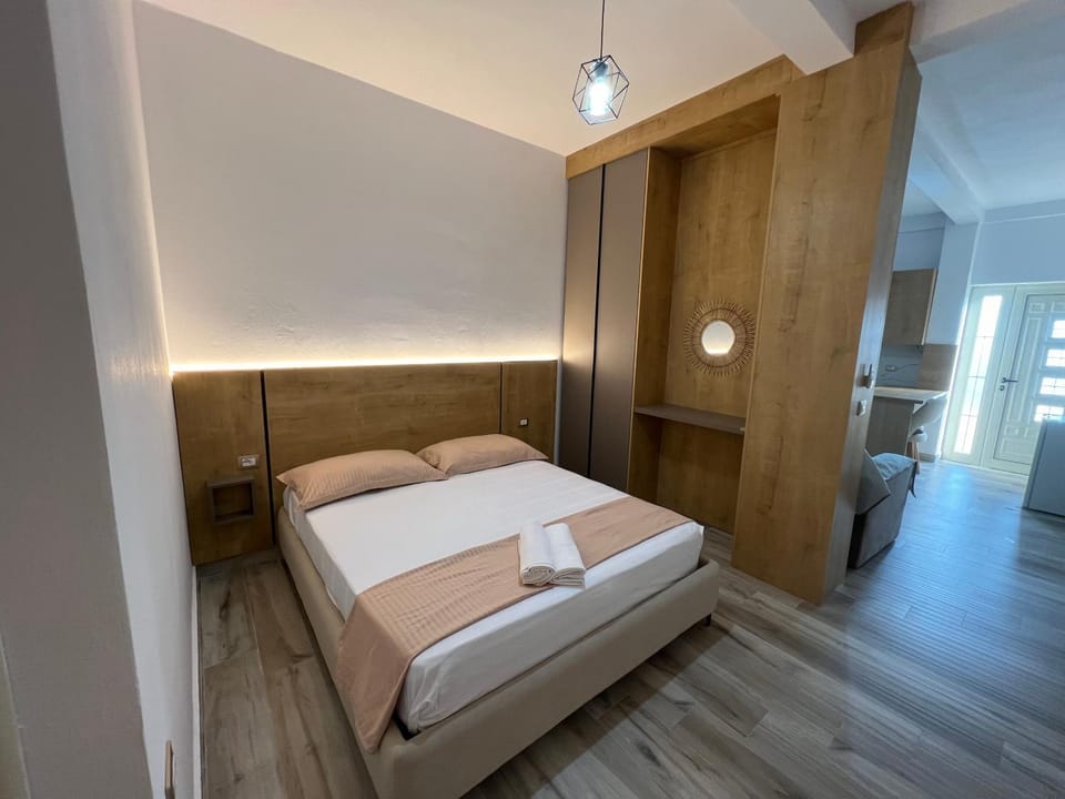 Bed, towels, wardrobe