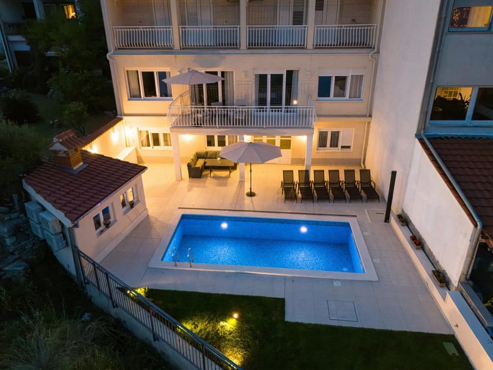 Property building, Night, Balcony/Terrace, Pool view, Swimming pool, sunbed