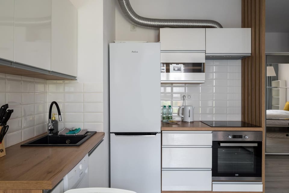 Kitchen or kitchenette, dishwasher, oven, stove