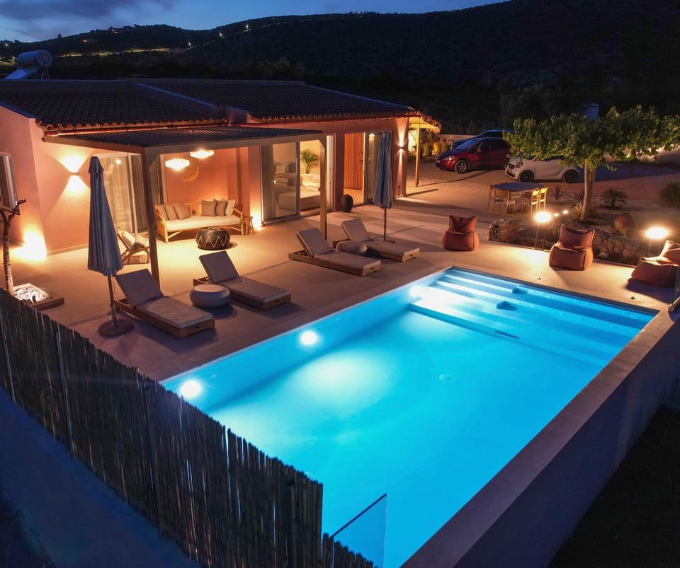 Property building, Patio, Night, Natural landscape, Mountain view, Pool view, Swimming pool, sunbed