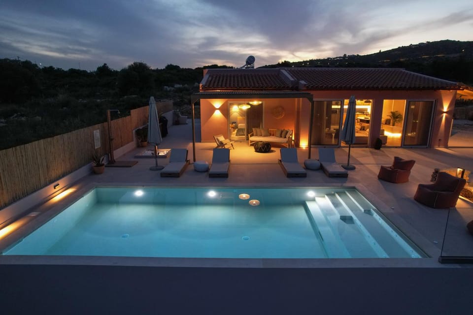 Property building, Patio, Night, Natural landscape, Pool view, Swimming pool, sunbed