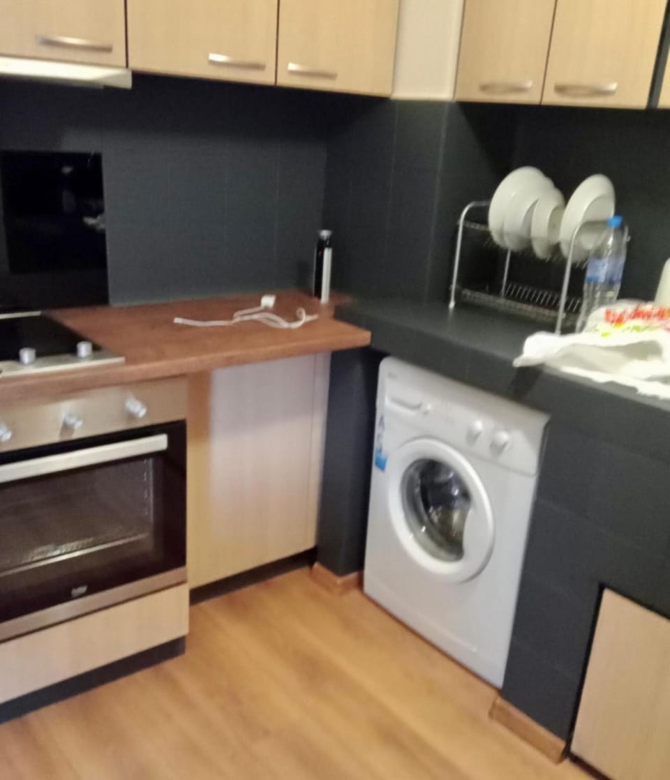 Kitchen or kitchenette, dishwasher, oven, stove, washing machine, dryer