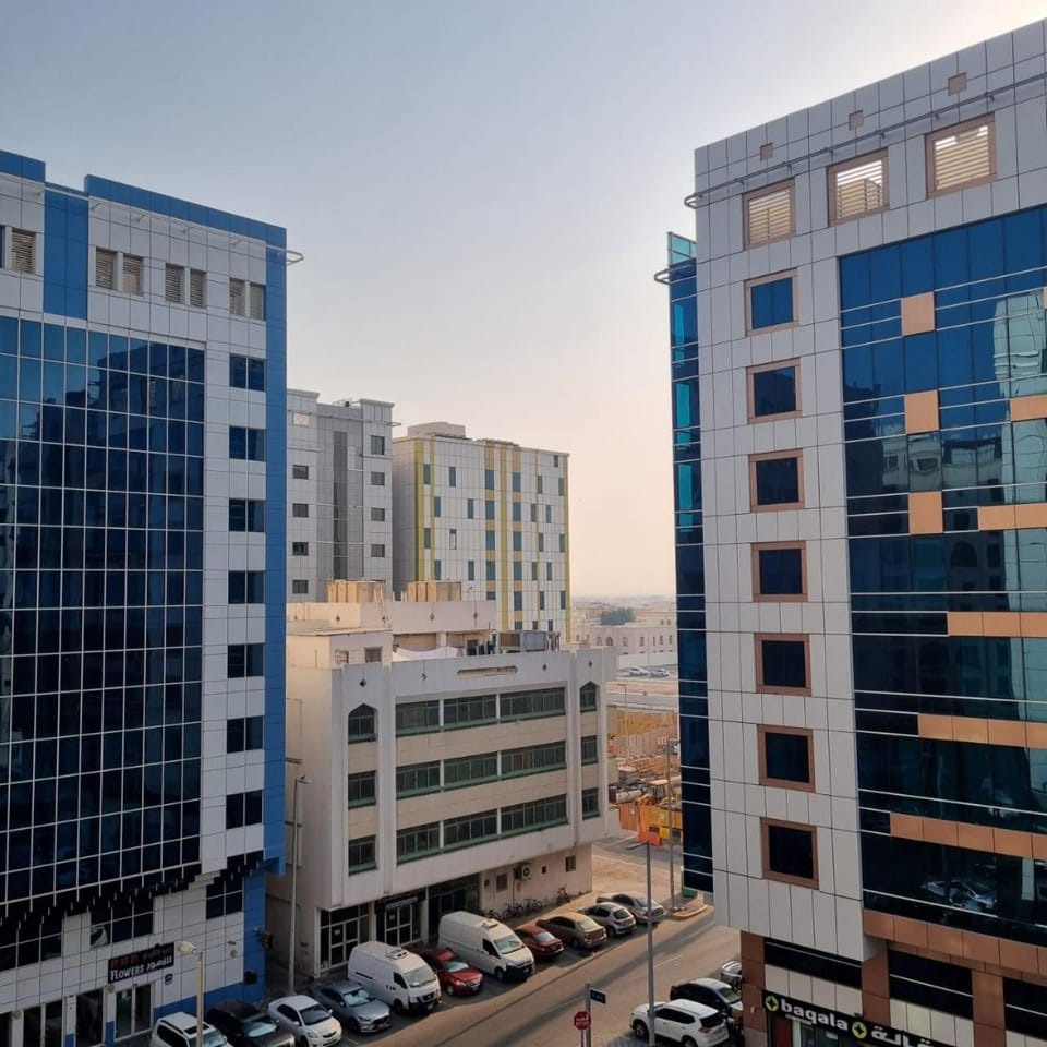 Property building, Day, View (from property/room), City view, Street view, Location, Parking