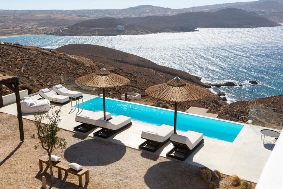Property building, Patio, Nearby landmark, Day, Natural landscape, View (from property/room), Balcony/Terrace, Seating area, Beach, Mountain view, Pool view, Sea view, Swimming pool, sunbed