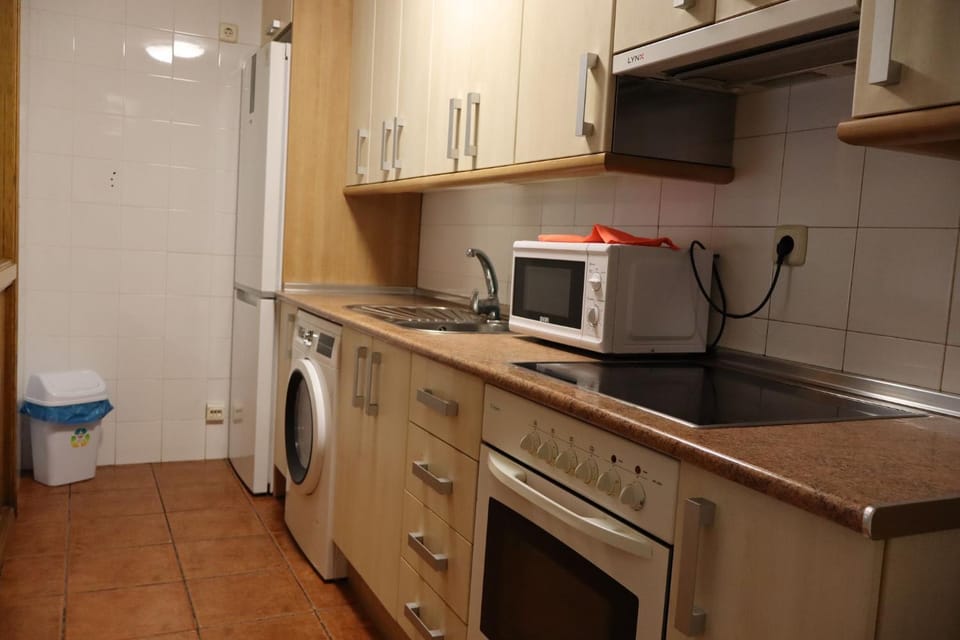 Kitchen or kitchenette, washing machine
