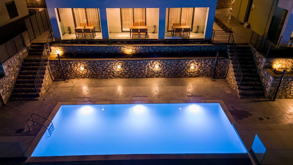 Patio, Night, View (from property/room), Balcony/Terrace, Living room, Seating area, Pool view, Swimming pool, Swimming pool, sunbed