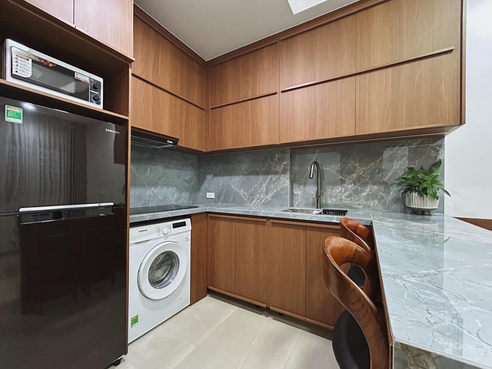 Kitchen or kitchenette, stove, washing machine, washing machine