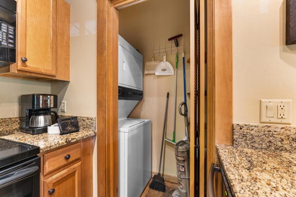 Kitchen or kitchenette, furniture, storage, laundry, washing machine, dryer
