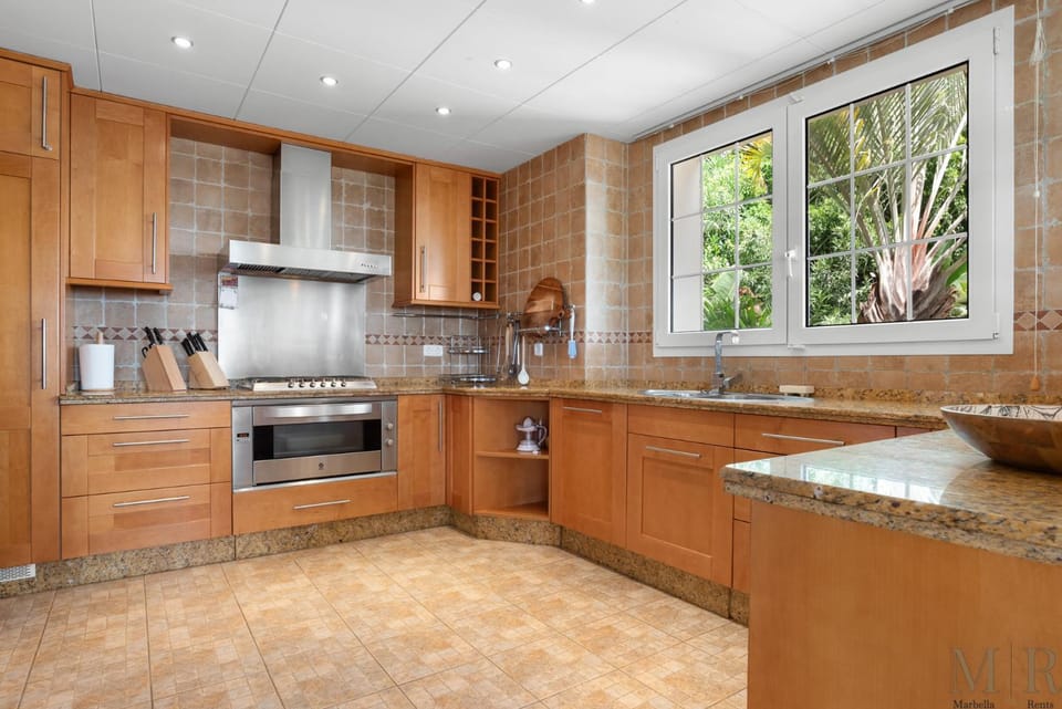 Kitchen or kitchenette, dishwasher, oven, stove, toaster
