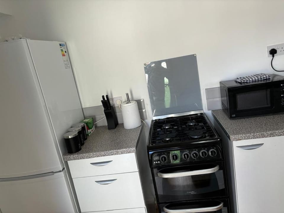 Kitchen or kitchenette, oven, stove