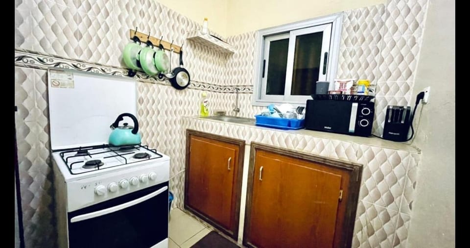 Kitchen or kitchenette, dishwasher, microwave, oven, stove, toaster