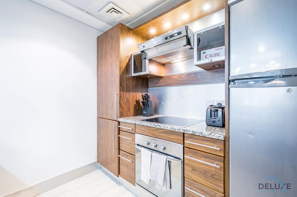 Kitchen or kitchenette, dishwasher, oven, stove, toaster