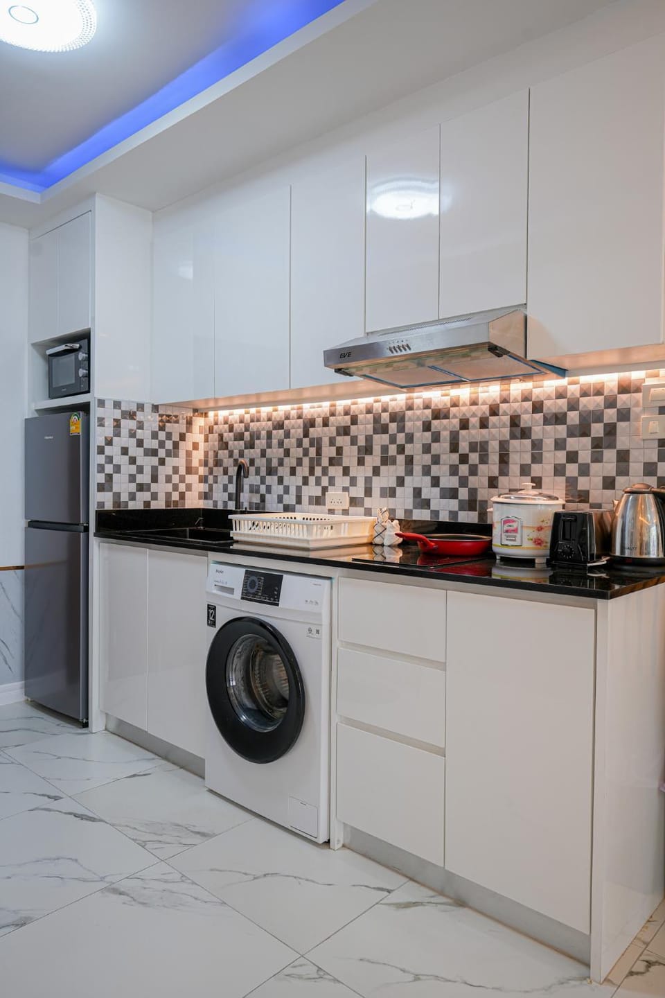 Kitchen or kitchenette, microwave, stove, toaster, laundry